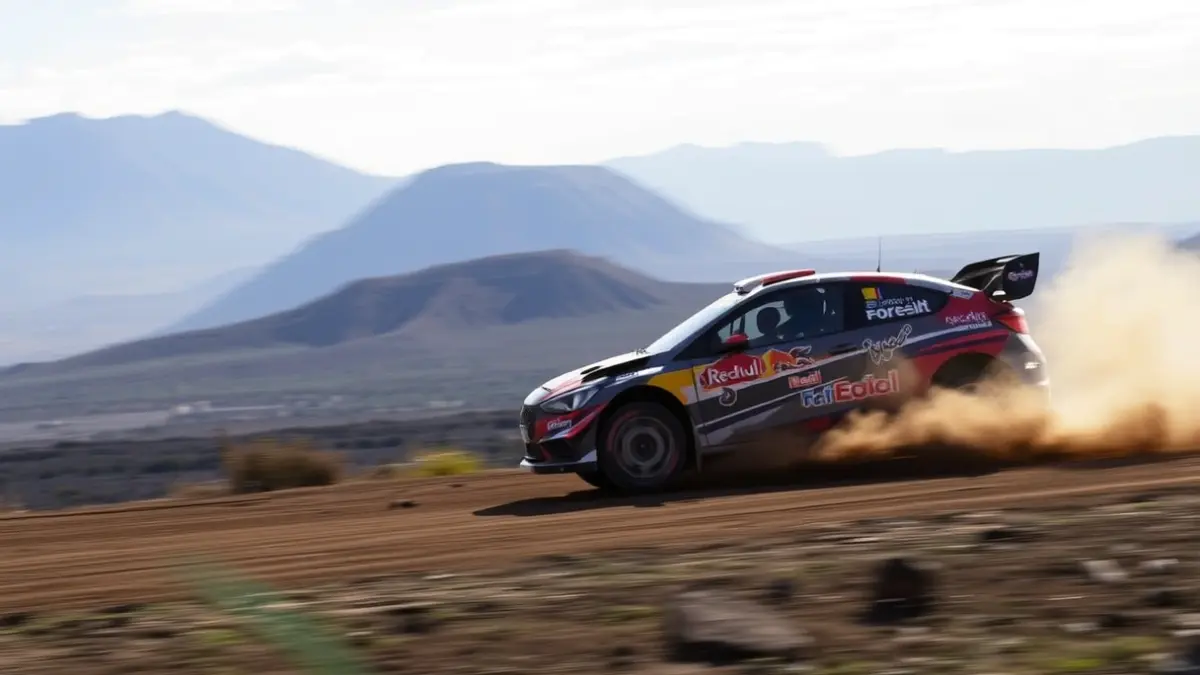 Image of a rally car in action in a volcanic landscape.