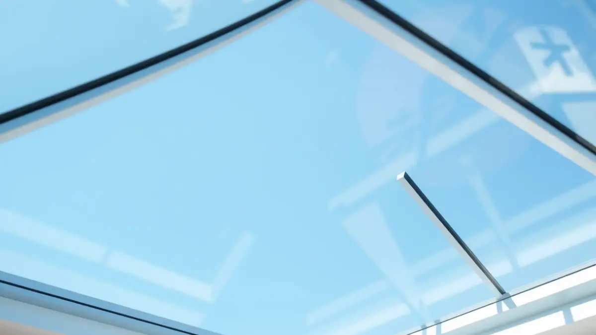 Generic image of a modern skylight on a roof, with sunlight.
