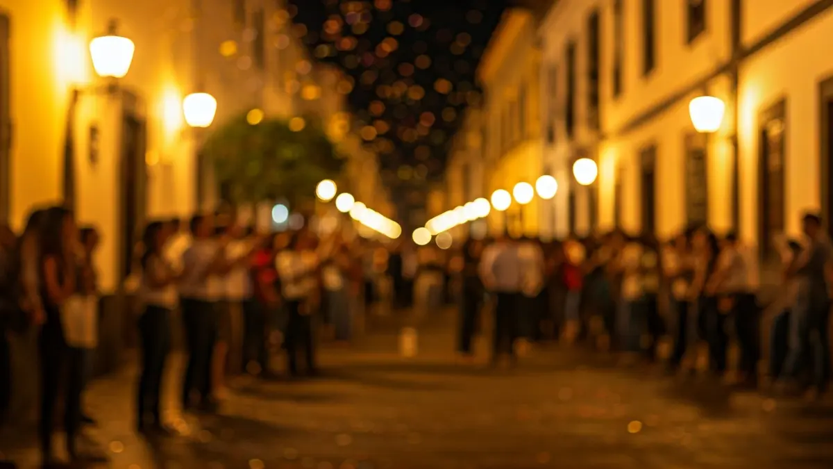 Imagen de una celebración cultural con gente y confeti en la calle.