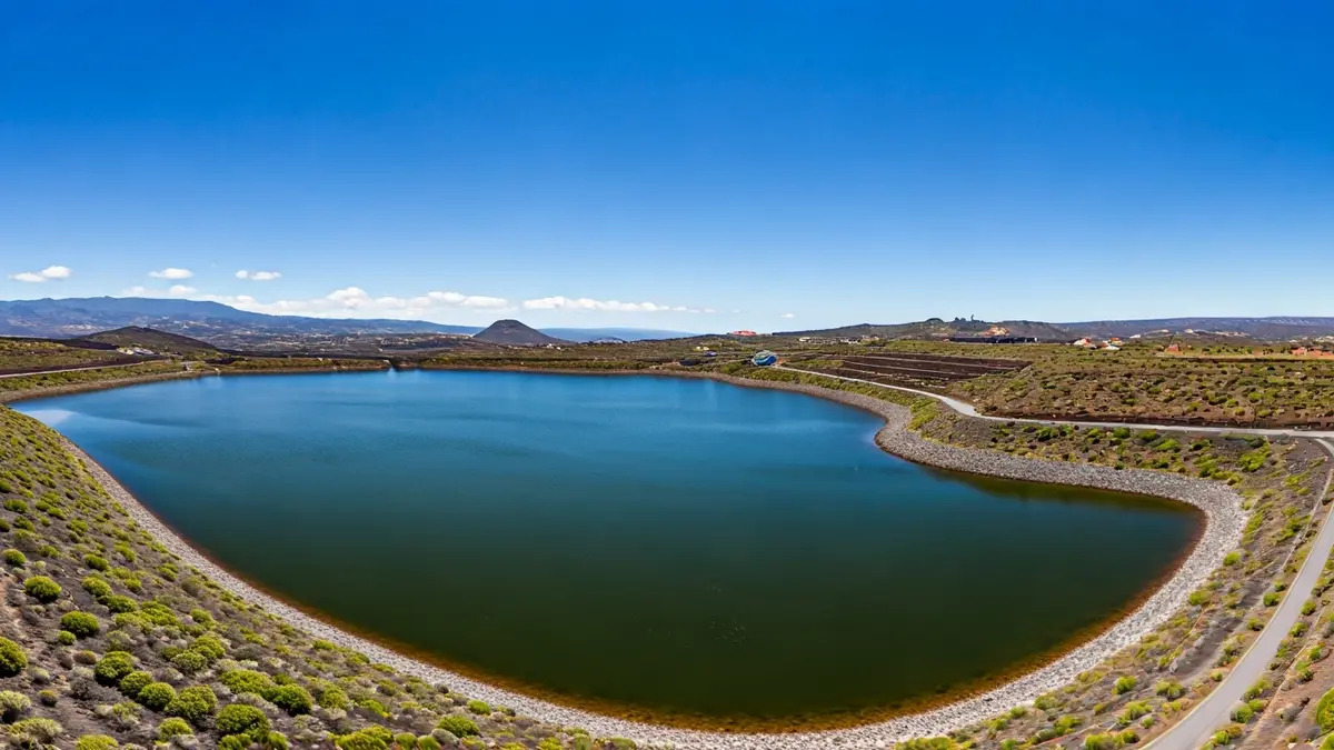 Aerial image of a water reservoir in a volcanic landscape of La Palma.