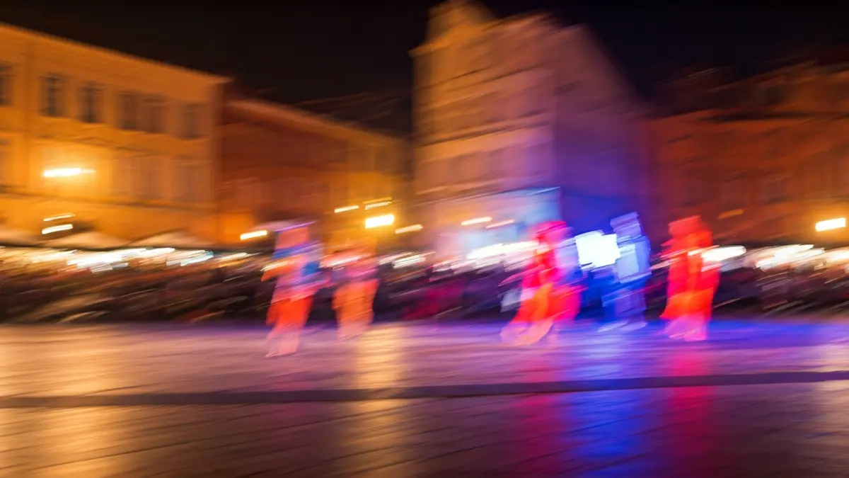 Generic image of a dance stage with dancers in motion and colorful lights.
