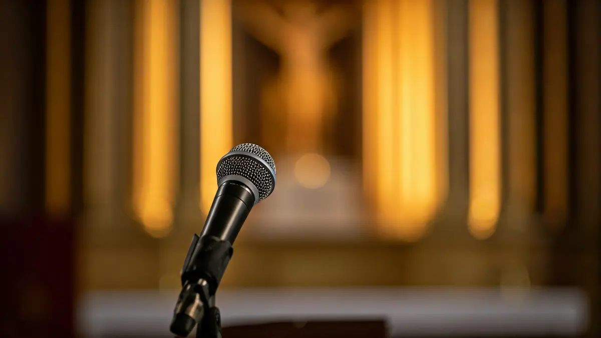 Generic image of a microphone on a podium, symbolizing a public event or speech.