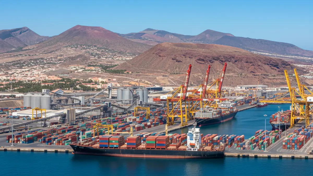 Generic image of a modern port with ships and cranes.