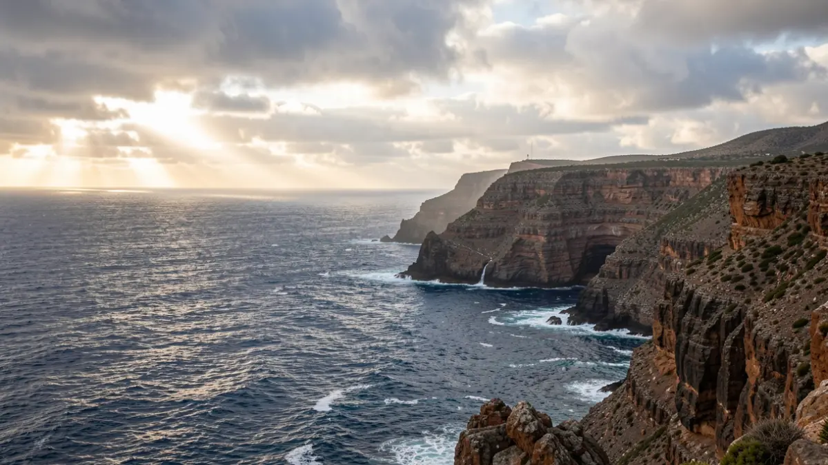 Cloudy view of the Gran Canaria coastline with the Atlantic Ocean.