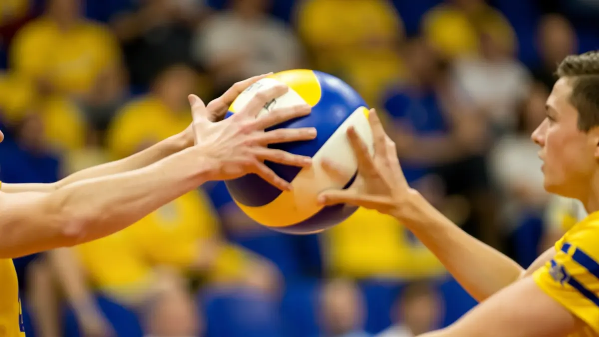 Volleyball player receiving a ball during a match.