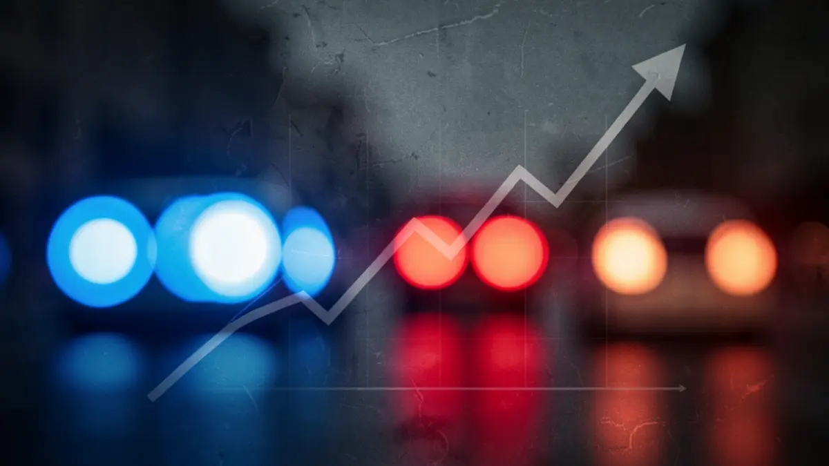 Generic image of blue and red emergency lights with an abstract trend graph.
