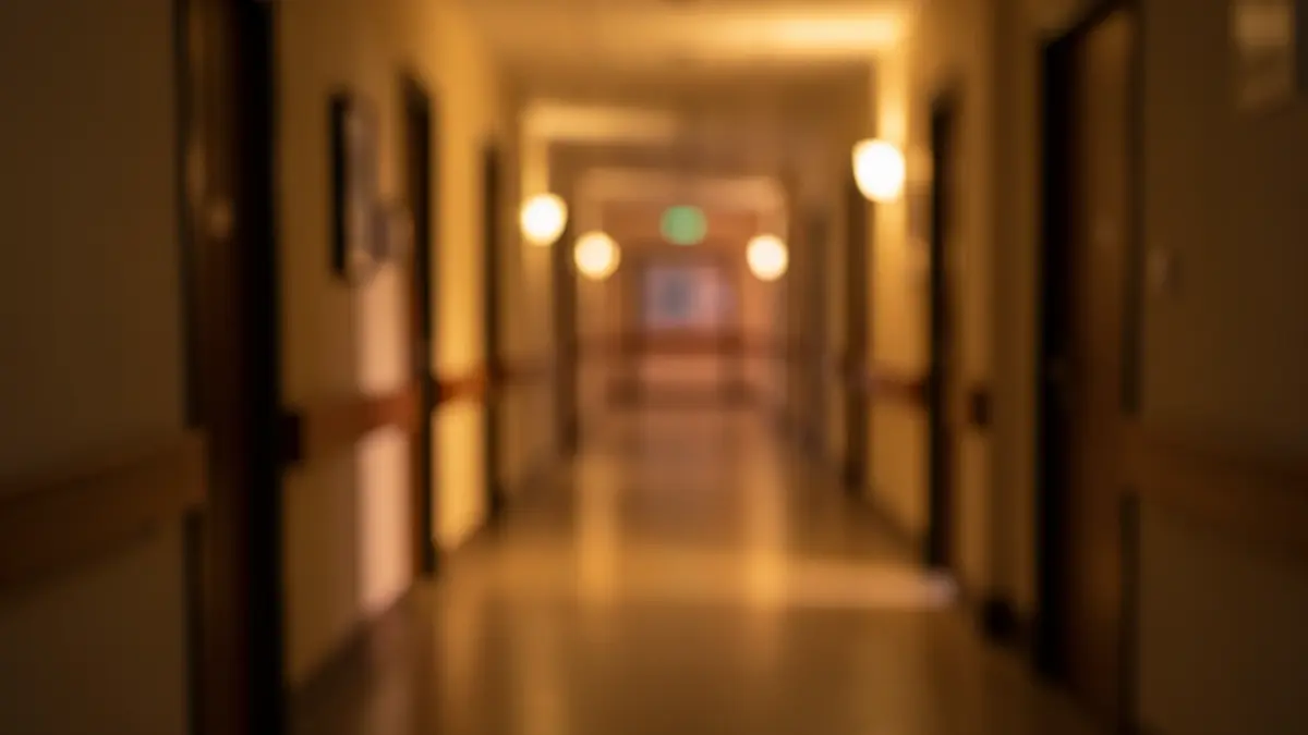 Generic image of a hospital hallway with dim lights.