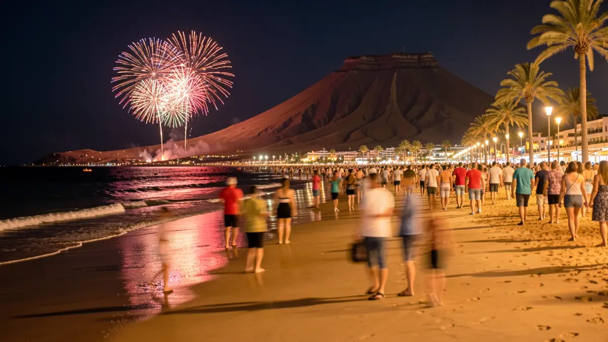 Generic image of Las Canteras beach in Las Palmas de Gran Canaria during San Juan night, with people and lights.
