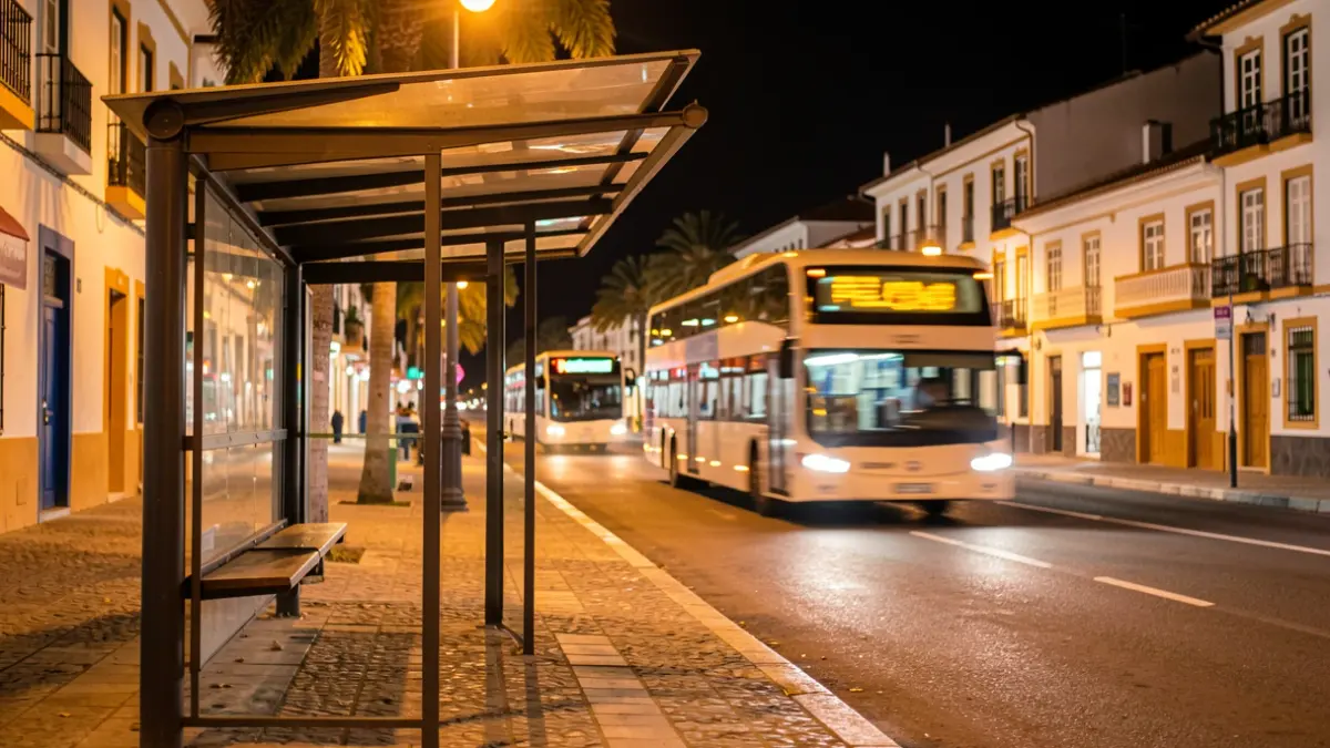 Bus stop in Tenerife at night with a bus approaching.