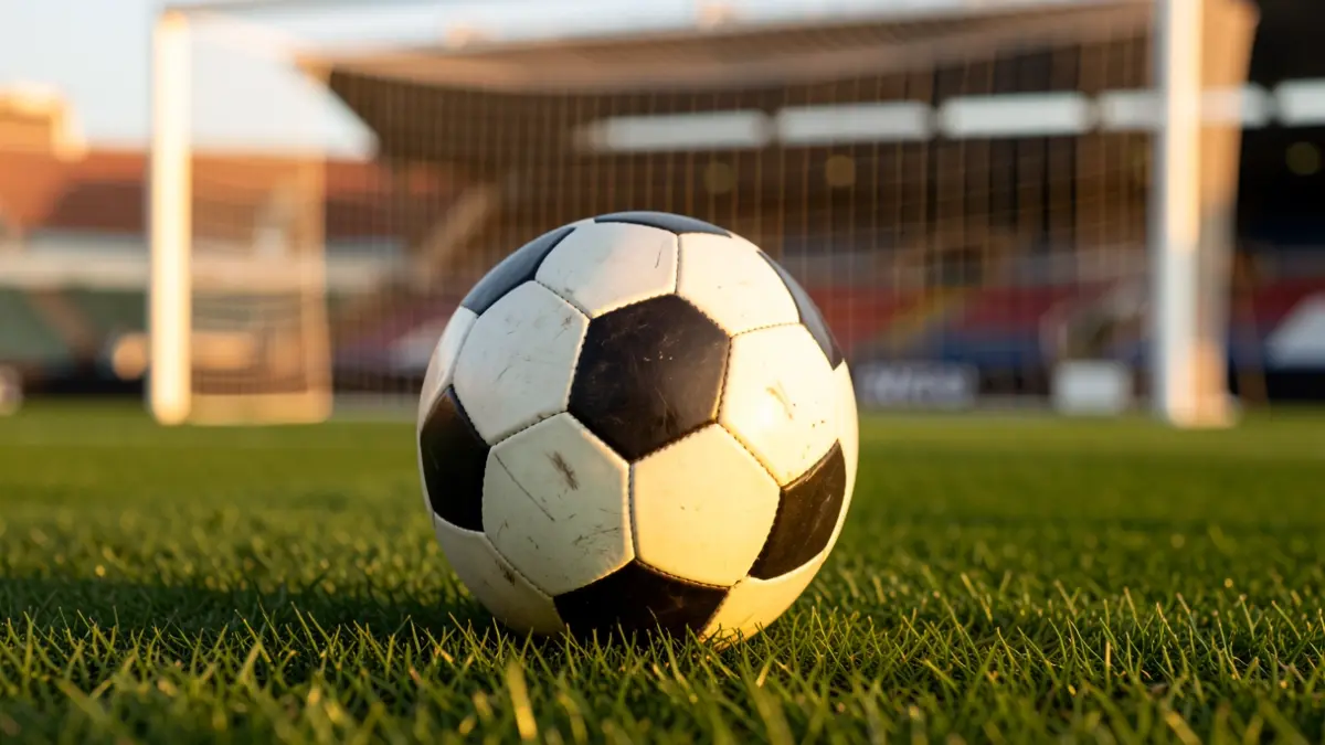 Soccer ball on a stadium pitch.