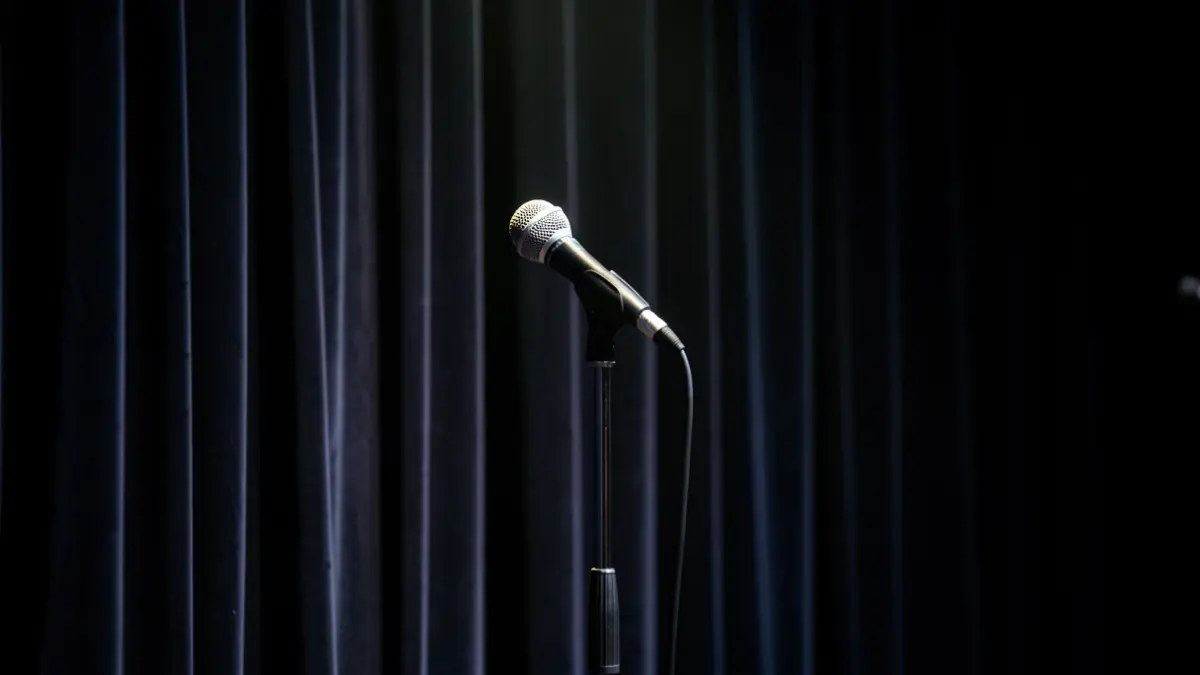 Generic image of a microphone on a stage.