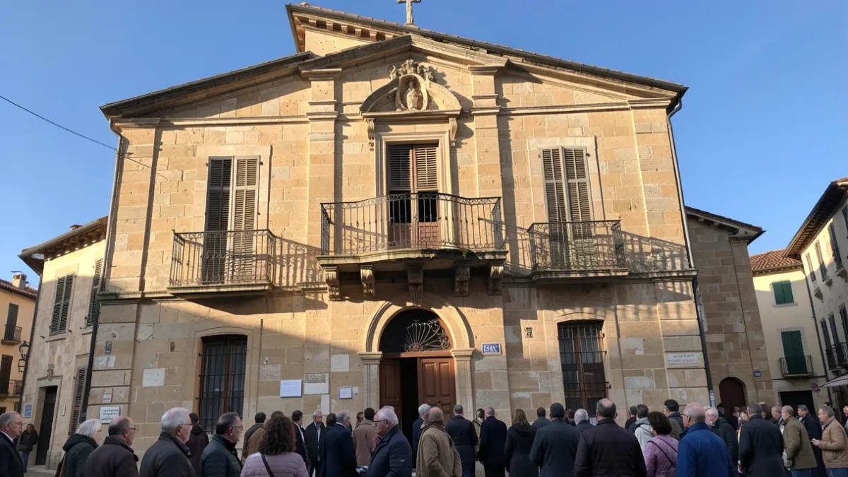Facade of the Arrecife Town Hall with balcony and iron railings, warm afternoon light.