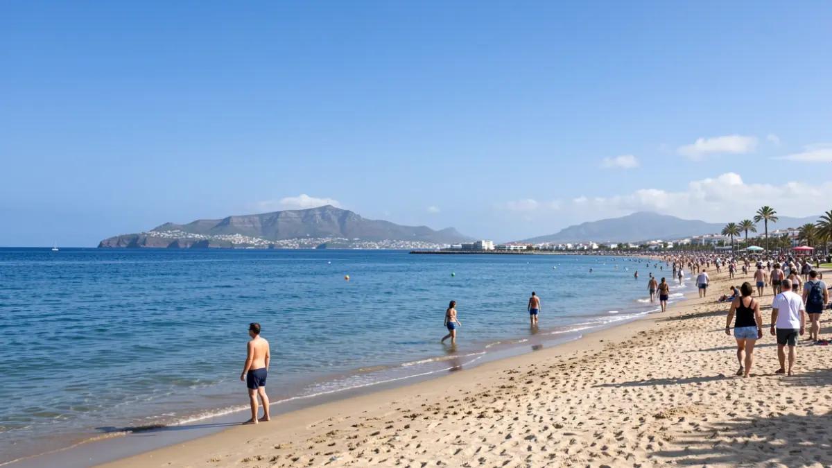 Generic image of a beach in the Canary Islands with bathers and calm waters.